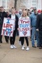 Young Trump Supporters Show Signs Outside Rally